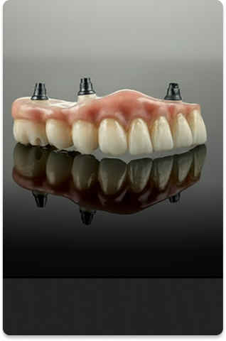 A set of dental implants with realistic gum coloring and teeth is displayed on a reflective surface against a gray background, conveying a clinical tone.